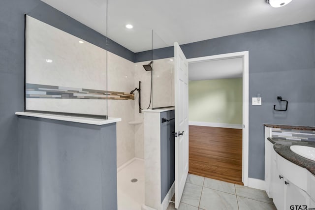 386 Fm 1711, Jacksonville, TX 75766 - full bathroom featuring tile patterned floors, baseboards, a walk in shower, and vanity