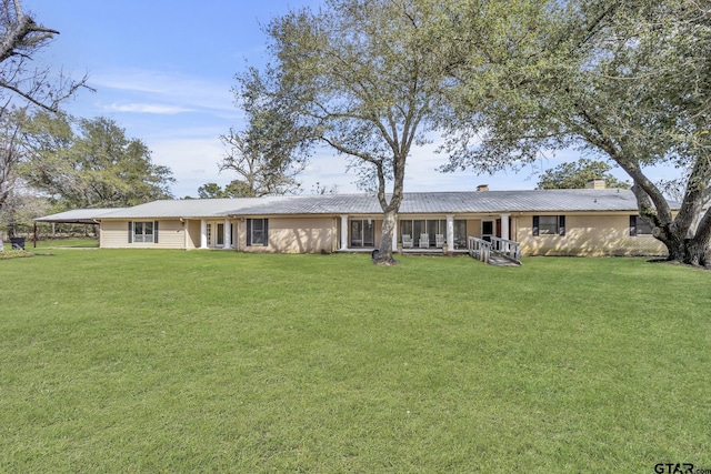 386 Fm 1711, Jacksonville, TX 75766 - view of front of house with metal roof, a chimney, and a front lawn