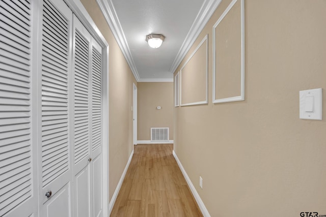 386 Fm 1711, Jacksonville, TX 75766 - hallway with ornamental molding, visible vents, light wood-style flooring, and baseboards