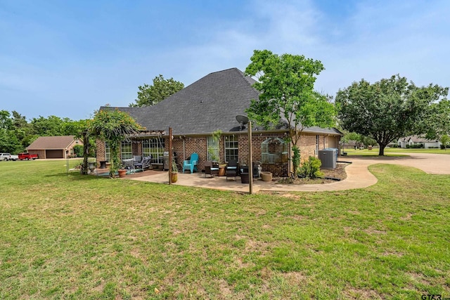 301 Hines Xing, Bullard, TX 75757 - rear view of house with a patio, a lawn, roof with shingles, brick siding, and central AC