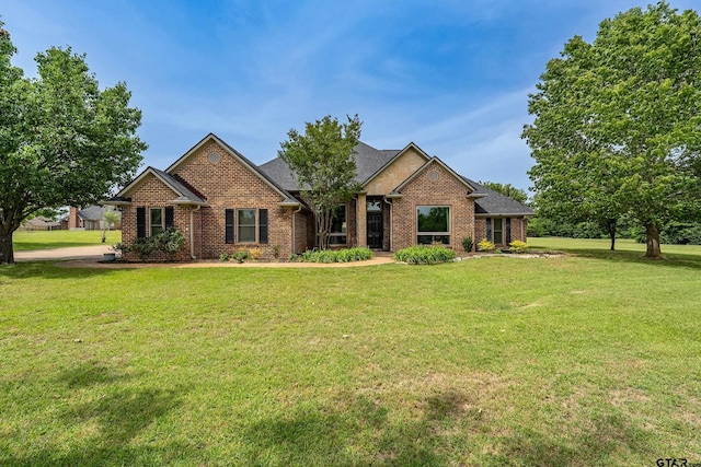 301 Hines Xing, Bullard, TX 75757 - view of front of house featuring a front lawn and brick siding