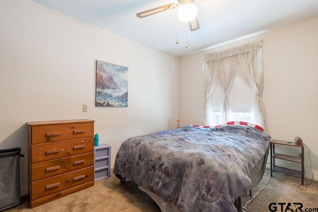 bedroom with ceiling fan and carpet floors