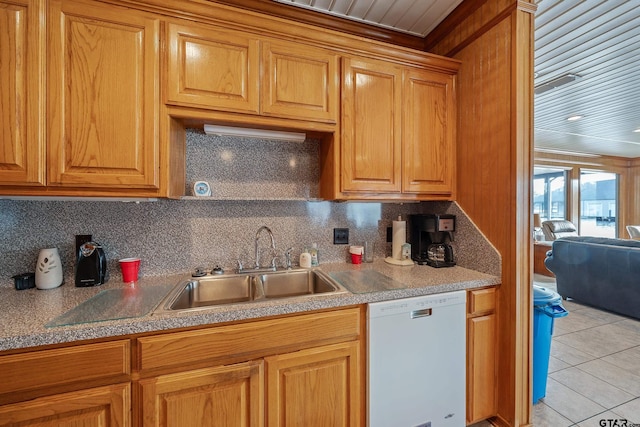 kitchen featuring sink, backsplash, crown molding, white dishwasher, and light tile patterned floors