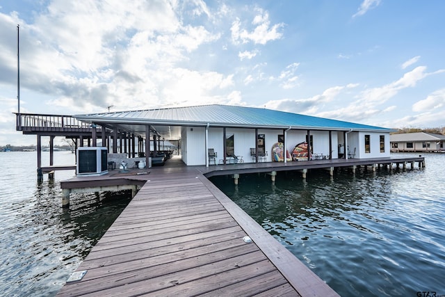 dock area featuring cooling unit and a water view