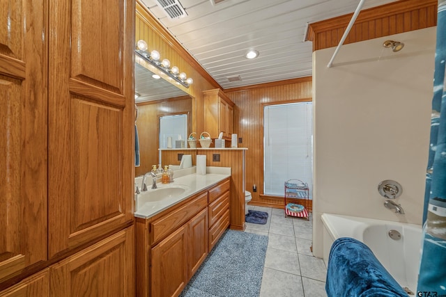 full bathroom with vanity, shower / tub combo with curtain, crown molding, tile patterned flooring, and toilet