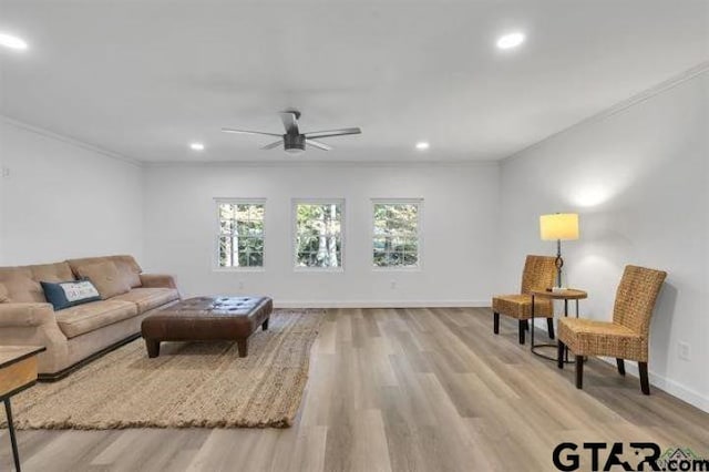 living room featuring recessed lighting, ceiling fan, ornamental molding, and wood finished floors