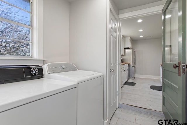 laundry area featuring washing machine and clothes dryer