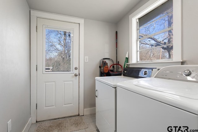 laundry area featuring washing machine and clothes dryer