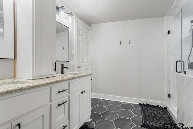 bathroom with tile patterned floors, vanity, and walk in shower