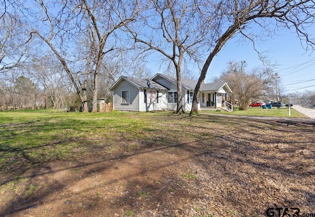 view of front of house featuring a front yard and a porch