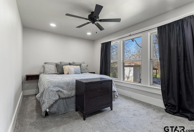 carpeted bedroom with ceiling fan