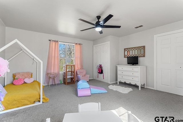 playroom with ceiling fan and carpet flooring