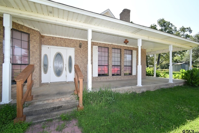 property entrance featuring covered porch