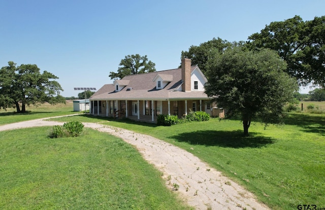 view of front of home with a front lawn and covered porch