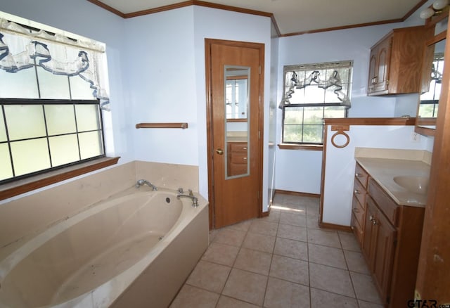 bathroom featuring crown molding, vanity, tile patterned flooring, and a bathtub