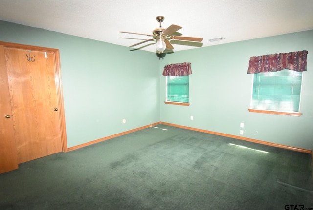 empty room with carpet floors and ceiling fan