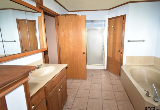 bathroom with vanity, tile patterned flooring, ornamental molding, and shower with separate bathtub