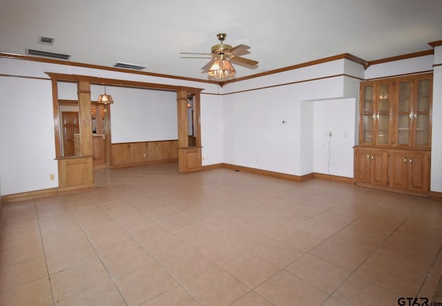 unfurnished room featuring light tile patterned floors, crown molding, and ceiling fan