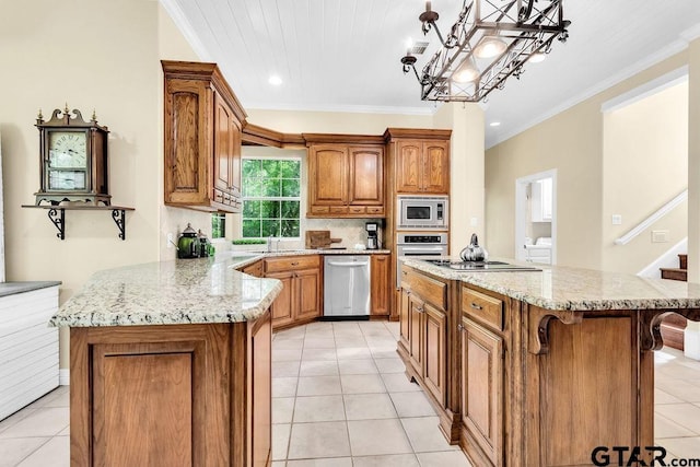 kitchen with crown molding, brown cabinets, light stone counters, light tile patterned floors, and stainless steel appliances