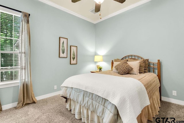 bedroom featuring carpet floors, multiple windows, and baseboards