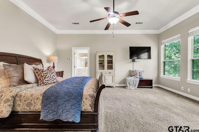 carpeted bedroom featuring crown molding, baseboards, and visible vents