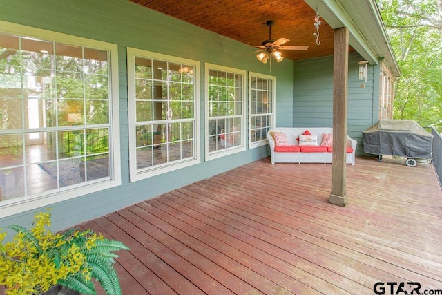 deck with ceiling fan and a grill