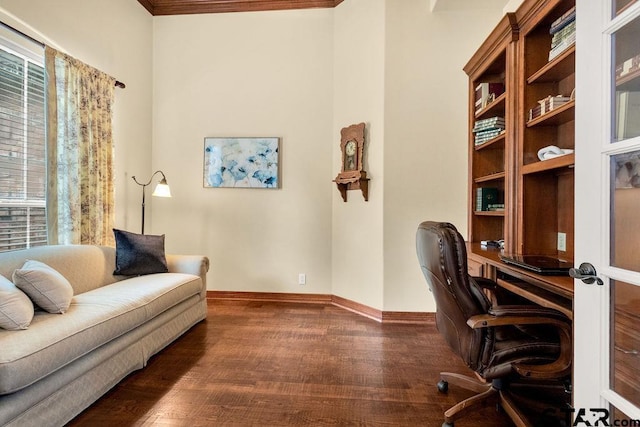 office space with crown molding, baseboards, and wood finished floors