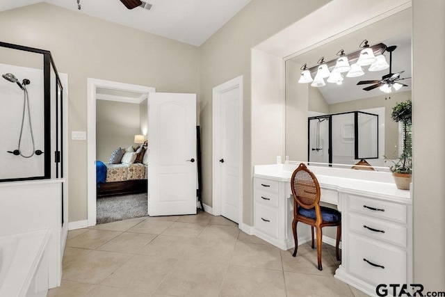 ensuite bathroom with vanity, ceiling fan, a stall shower, and connected bathroom