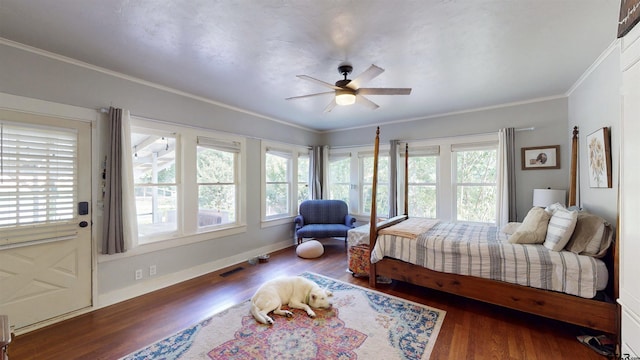 601 Troup Hwy, Tyler, TX 75701 - bedroom with wood finished floors, ornamental molding, baseboards, and a ceiling fan