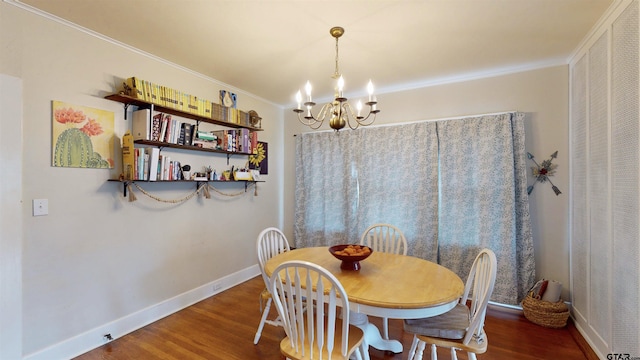 601 Troup Hwy, Tyler, TX 75701 - dining room with a chandelier, wood finished floors, baseboards, and crown molding