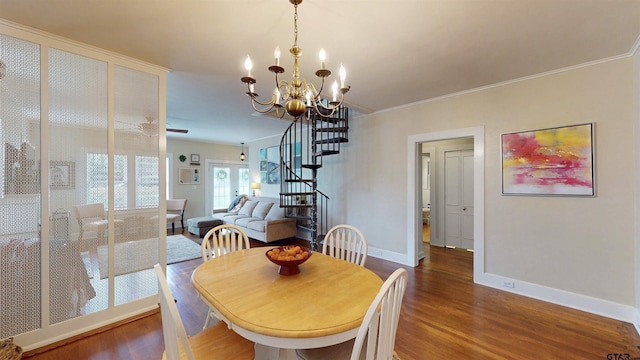 601 Troup Hwy, Tyler, TX 75701 - dining room with wood finished floors, stairs, baseboards, a chandelier, and crown molding