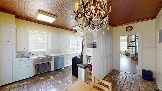 601 Troup Hwy, Tyler, TX 75701 - kitchen featuring stainless steel dishwasher, a sink, white cabinets, brick flooring, and wainscoting