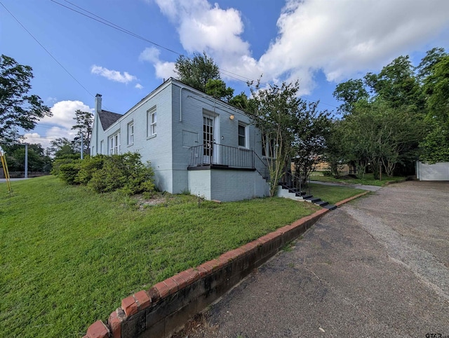 601 Troup Hwy, Tyler, TX 75701 - view of side of home with a lawn