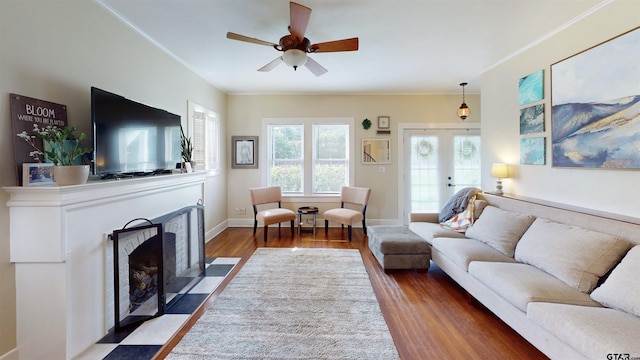 601 Troup Hwy, Tyler, TX 75701 - living room featuring wood finished floors, a fireplace with flush hearth, ceiling fan, french doors, and baseboards