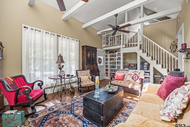 living room featuring high vaulted ceiling, hardwood / wood-style flooring, and ceiling fan