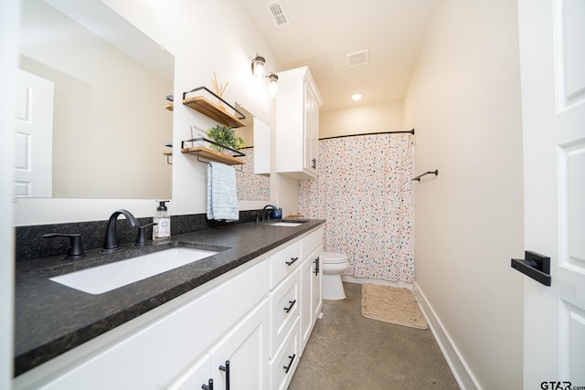 bathroom with walk in shower, vanity, and toilet