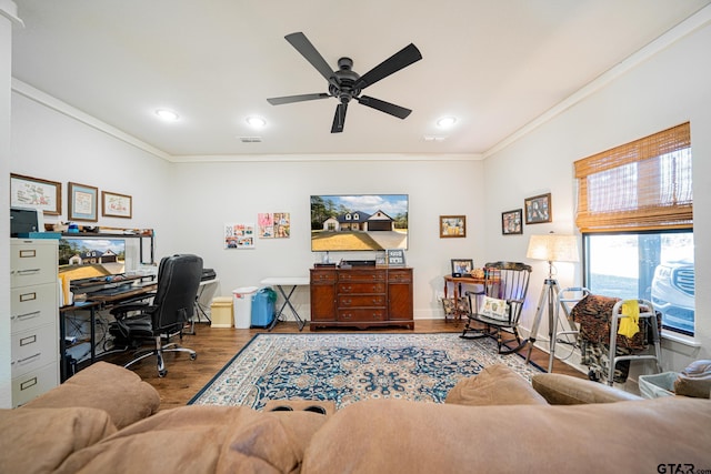 home office with hardwood / wood-style flooring, ceiling fan, and crown molding