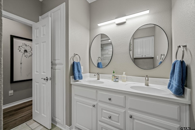 bathroom with vanity and hardwood / wood-style flooring