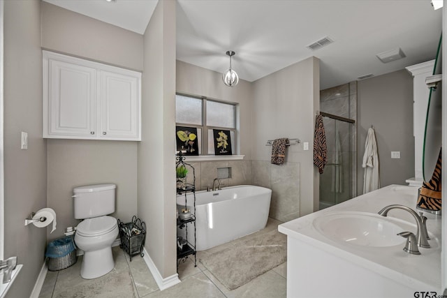 full bathroom with tile patterned floors, separate shower and tub, vanity, and toilet