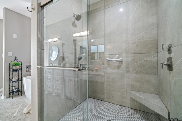 bathroom featuring separate shower and tub