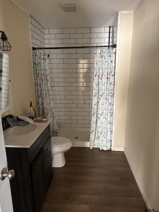bathroom with vanity, hardwood / wood-style floors, toilet, and a shower with shower curtain