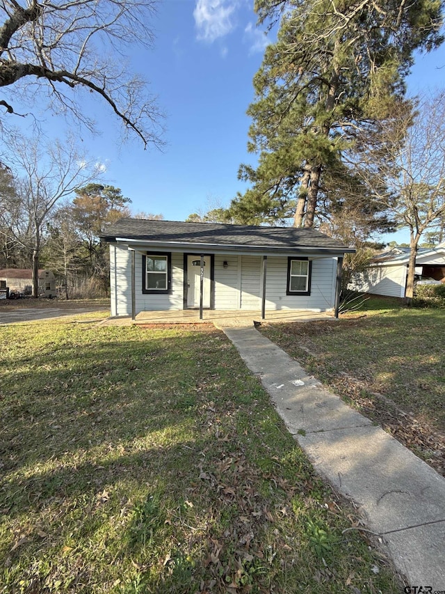 ranch-style home with a front lawn