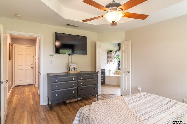 bedroom featuring hardwood / wood-style floors and ceiling fan