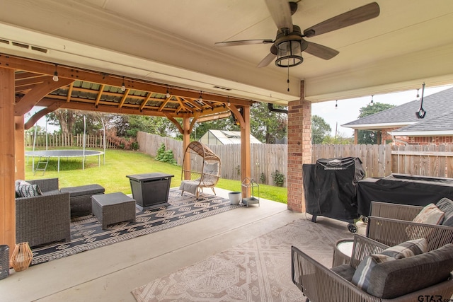 view of patio / terrace with ceiling fan, grilling area, outdoor lounge area, and a trampoline