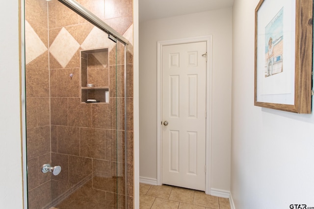 bathroom featuring tile patterned flooring and walk in shower