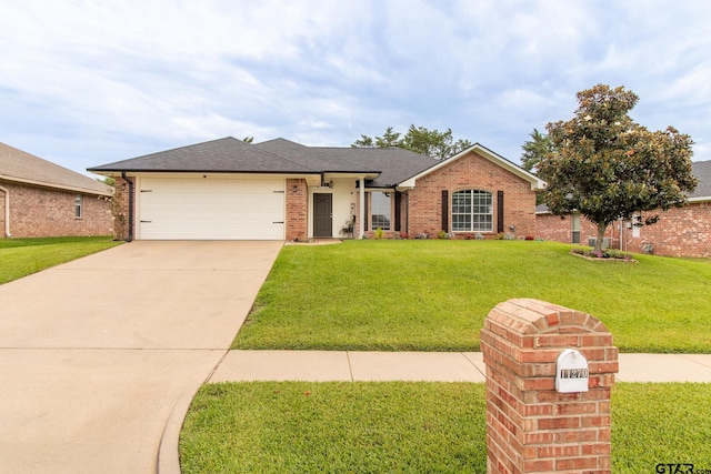 ranch-style home with a garage and a front yard