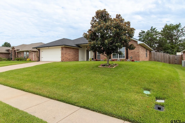 view of front facade featuring a garage and a front lawn