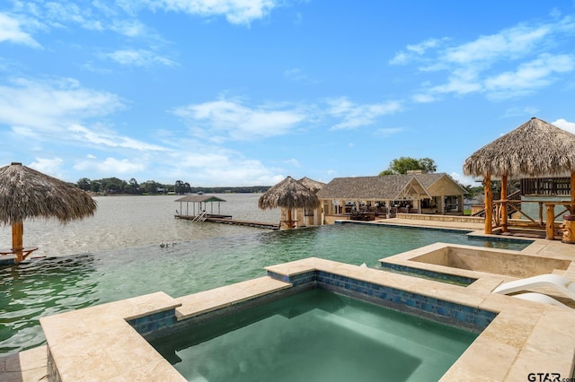 220 Pin Oak Dr, Mabank, TX 75156 - view of swimming pool with a water view, a boat dock, and a pool with connected hot tub