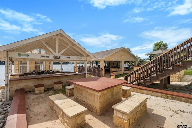 220 Pin Oak Dr, Mabank, TX 75156 - view of patio / terrace with a gazebo, stairs, a bar, and a water view