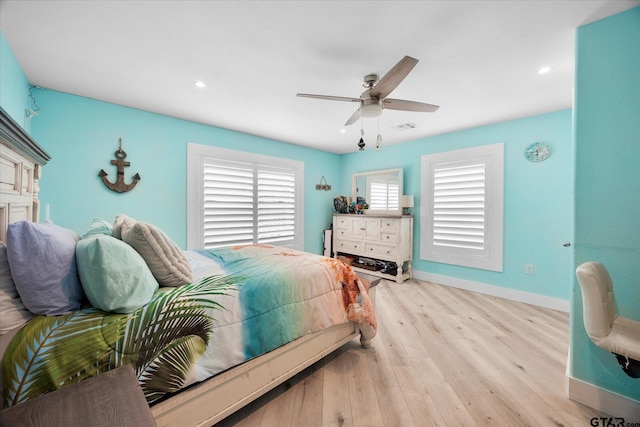 220 Pin Oak Dr, Mabank, TX 75156 - bedroom with wood finished floors, ceiling fan, recessed lighting, and a fireplace